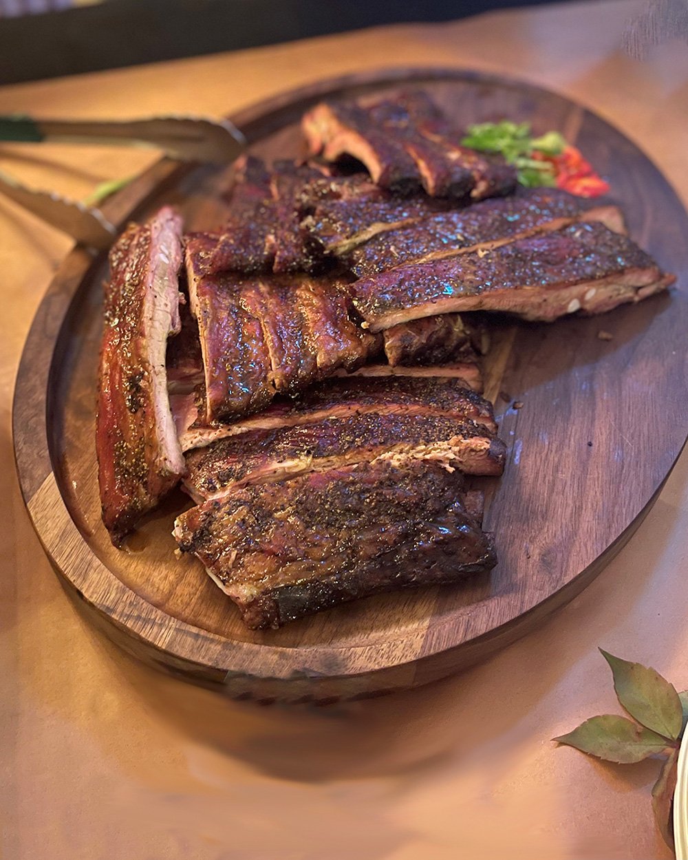 smoked bbq ribs on a wood platter